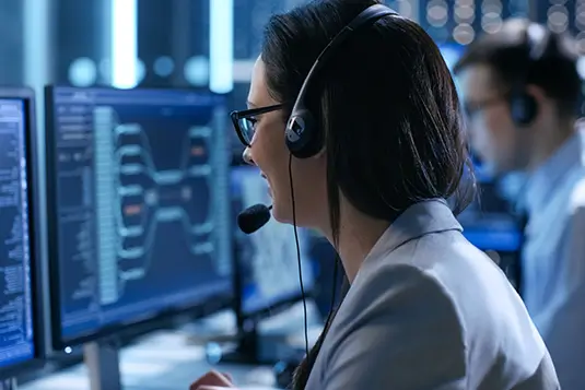 A woman in an IT support center